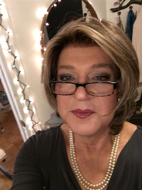 An Older Woman Taking Her Selfie And With A New Hair Do And Makeup