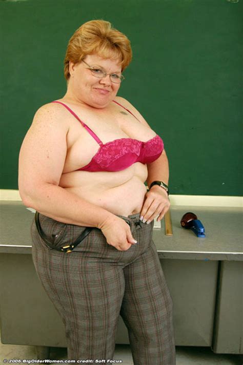 glassed fat mature teacher stripping and posing in classroom