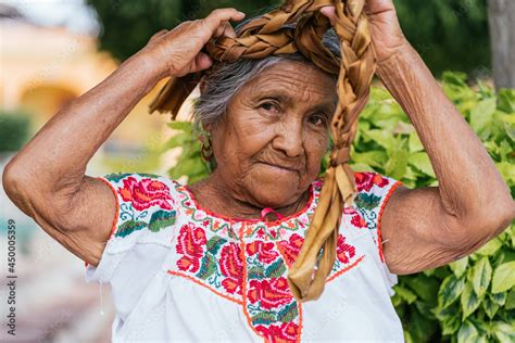 Old Mexican Woman Combing Hair Adult Woman Looking At Camera Wears