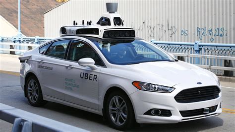 uber launches   driving taxi fleet