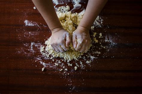 person mixing dough  stock photo