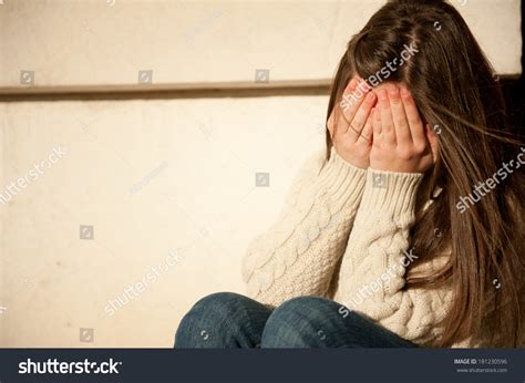 young girl covering  face   hands stock photo  shutterstock
