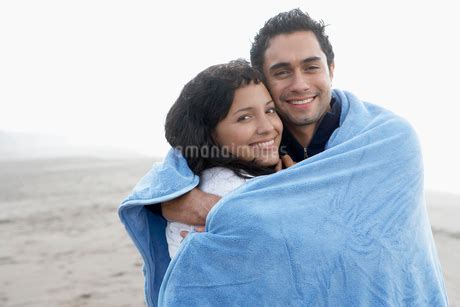 young couple wrapped  towel fyi amanaimages