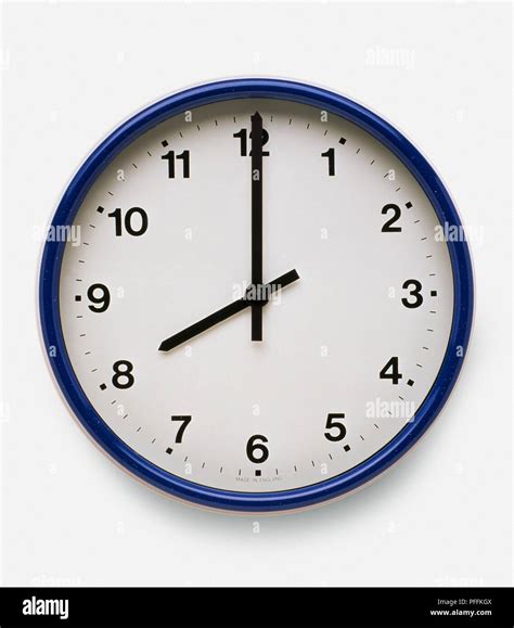 blue wall clock   oclock stock photo alamy