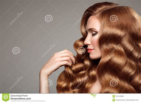 Portrait Of Woman With Long Curly Beautiful Ginger Hair