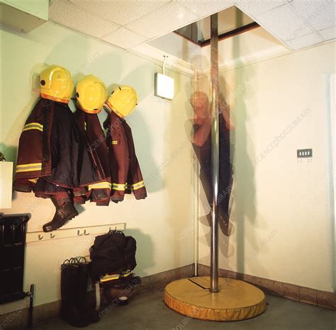 firefighter sliding  pole stock image  science photo