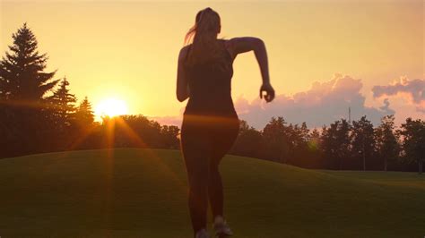 woman running   sunset young woman running sunset fitness woman running outdoors real