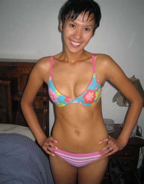Shorthaired Asian Chick Wearing Micro Bikini And Teasing