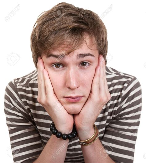 bored young man  hands  face  white background stock photo  hands  face