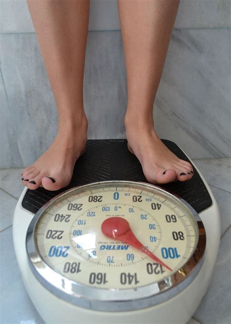 bathroom scale  kilos scale weight loss fitness dieting health weight loss woman