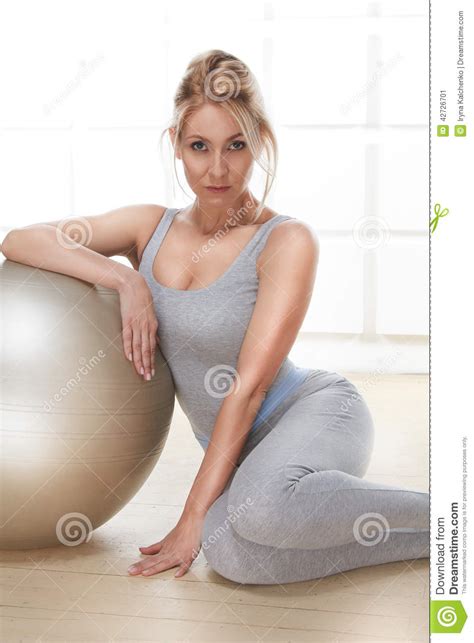 beautiful sexy blonde perfect athletic slim figure engaged in yoga exercise or fitness lead a