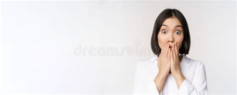 Close Up Face Of Asian Woman Gasping Looking Shocked And Speechless