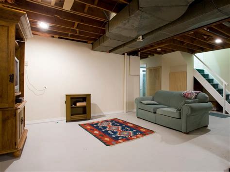 basement renovation transforms  cold space   warm family room hgtv