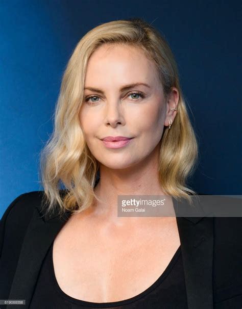 charlize theron wears our mini ear cuff with white diamonds on howard stern press charlize