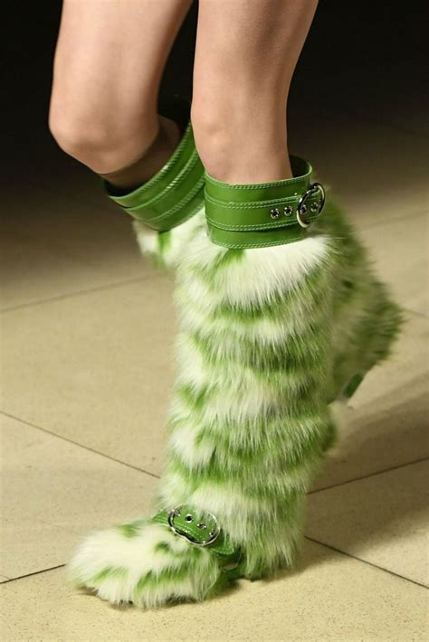 craziest runway shoes  paris fashion week fall  green boots miu miu fur boots