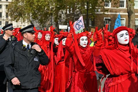 extinction rebellion london protests  activists carry  red handed march  westminster