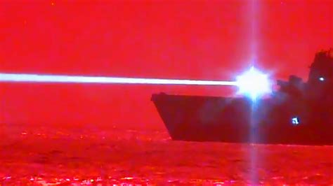 amphibious warship uss portland  shot   drone    high power laser