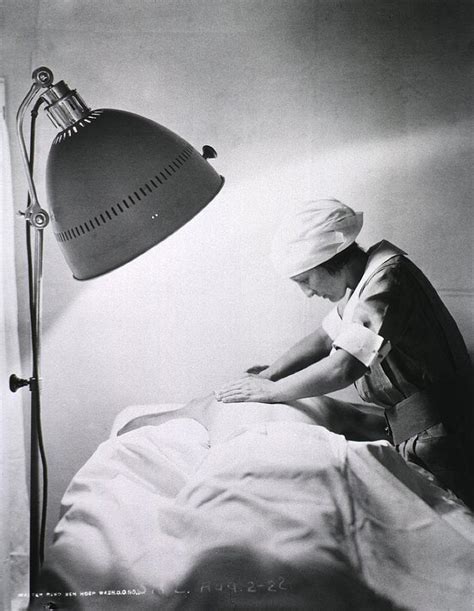 Nurse Giving Back Rub To A Patient Photograph By Everett