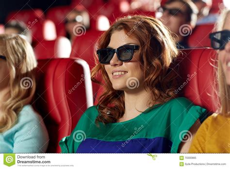 happy friends watching movie in 3d theater stock image