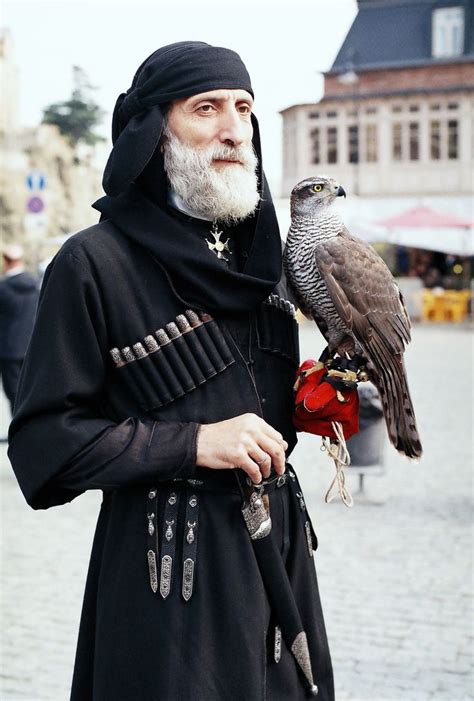 georgian man with falcon wearing chokha on tbilisoba