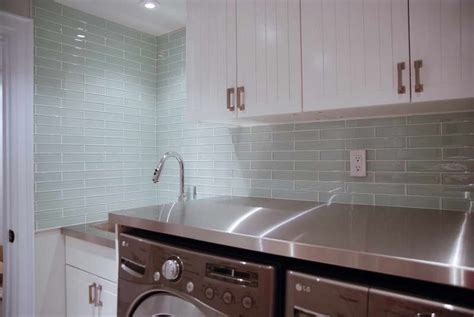 White Cabinets Next To Clear Glass Tile Shows Hint Of Green