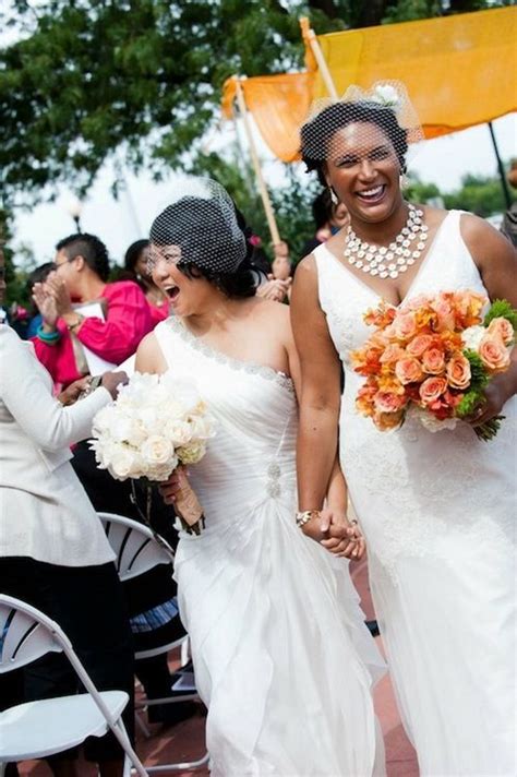 lovely couple lesbian wedding two white gowns interracial poc