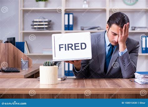 young male employee  fired   work stock photo image  auditor dismissing