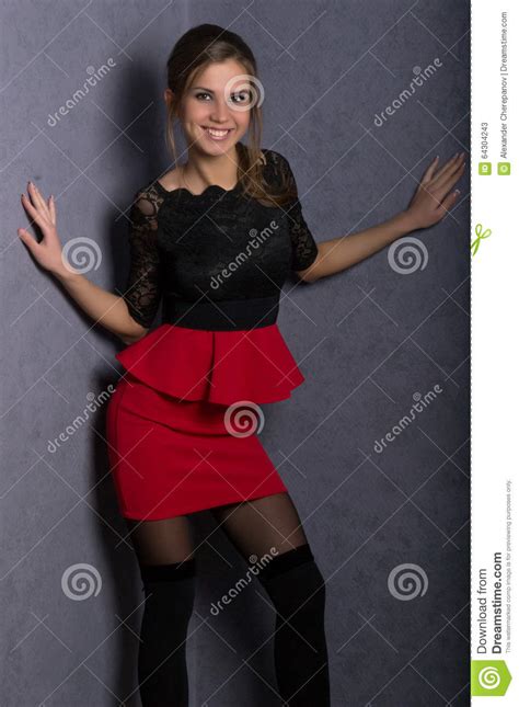 Beautiful Brunette Girl In Red Short Skirt Stock Image
