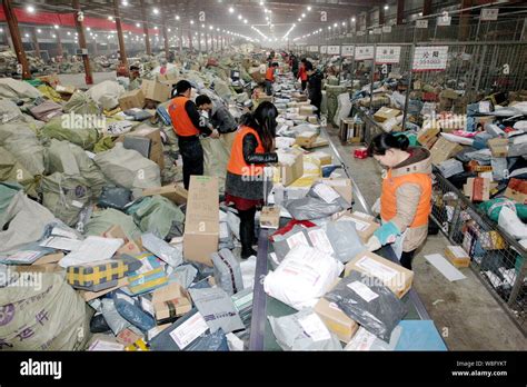 file chinese workers sort parcels       shopping   distribution
