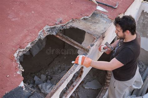 young man pulling   ceiling   house  stock photo image  debris demolish