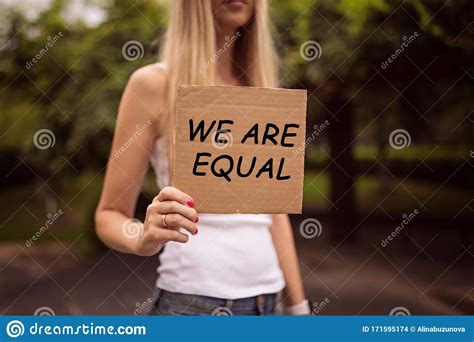 Gender Equality Concept As Woman Hands Holding A Paper Sheet With
