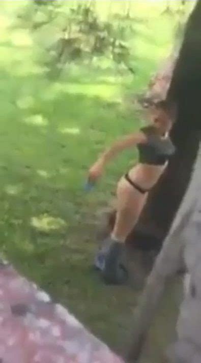 bizarre video shows woman taking cheeky bum selfie in a public park