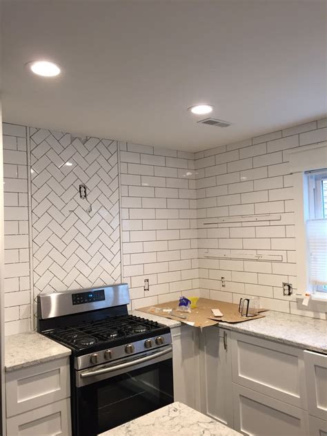 herringbone accent  stove  process kitchen backsplash designs white subway tiles