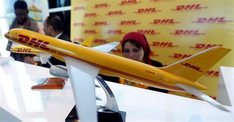 dhl groups  earnings slump  freight volumes  reuters