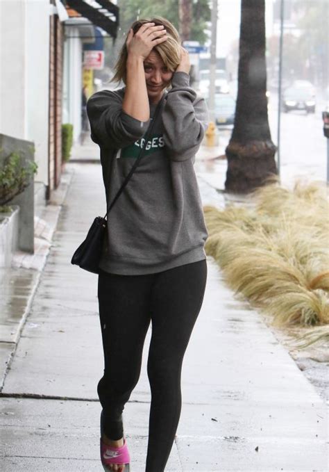 kaley cuoco in spandex leaving the gym getting caught in the rain without an umbrella 12 22 2015