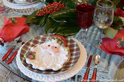 christmas tablescape with magnolia and nandina centerpiece