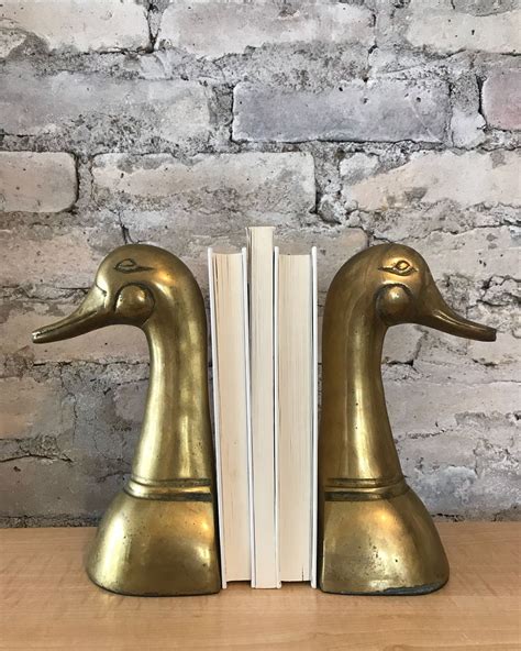 thrift store treasures vintage brass bookends  give  home decor  unique classic touch