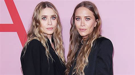 mary kate and ashley olsen pose with john stamos in