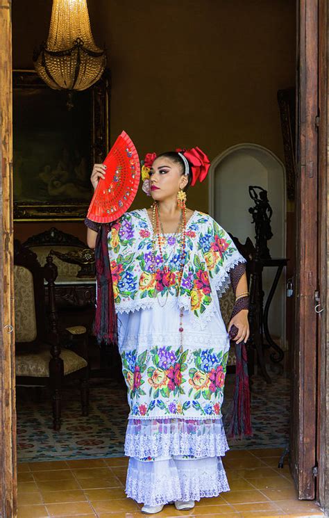 Woman In Traditional Mexican Embroidered Huipil Tunic And Dress