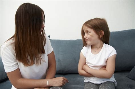 premium photo mother teaches daughter mom scolds girl the litlle