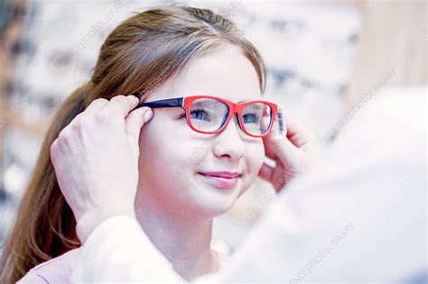 Optometrist Trying Glasses On Girl Stock Image F018 2838 Science