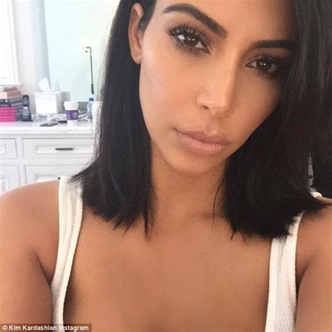Kim Kardashian Debuts Shorter Locks In Demure Black Outfit