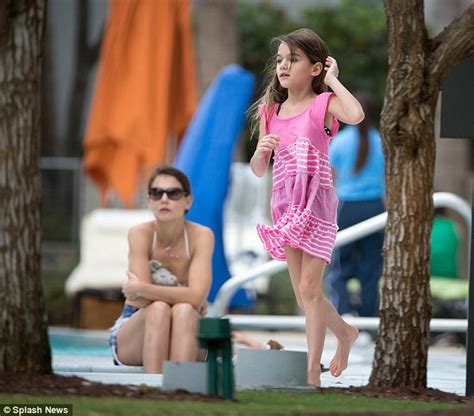 katie holmes slips her toned figure into bikini top and cut offs as she