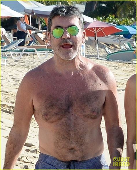 simon cowell goes shirtless at the beach with longtime love lauren