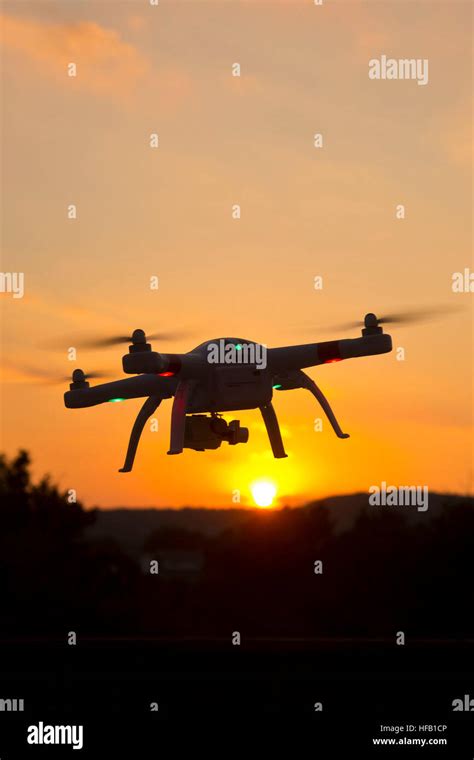 drone hovering  sunset stock photo alamy