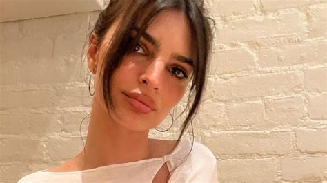 emily ratajkowski went braless in a side boob baring cardigan for a