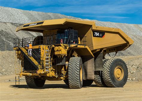 cat  ac mining truck proves performance rock dirt blog