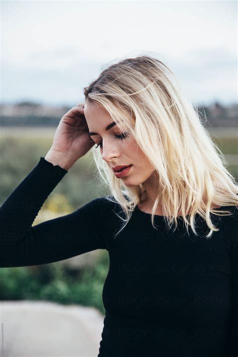 beautiful blonde female wearing black by stocksy contributor curtis