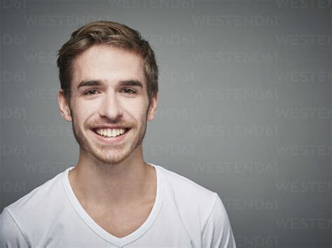 portrait  smiling young man stock photo