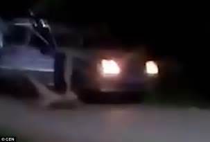 naked drunk man jumps on top of a russian police car and